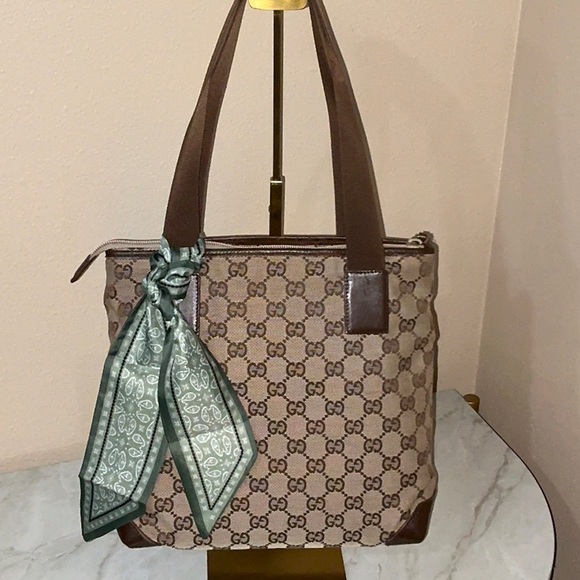 Gucci Handbags - Authentic!!! Gucci GG canvas tote bag with brown leather comes with COA